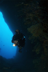 Buddy Ray exploring one of Estartit caves by Sven Tramaux 